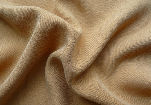 Why does Tencel fabric harden as soon as it is exposed to water