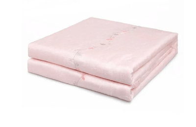How often should air conditioner quilts be washed?